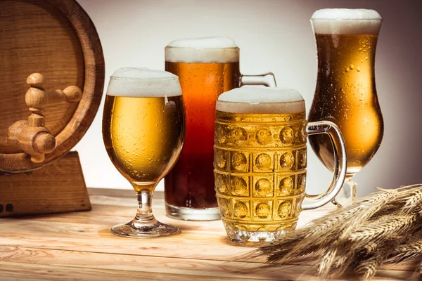 Barrel and different beer — Stock Photo