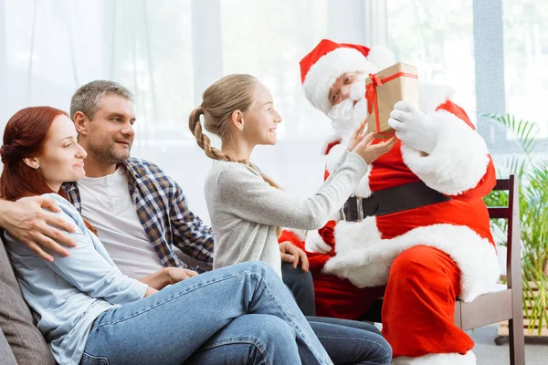 Family and santa claus — Stock Photo