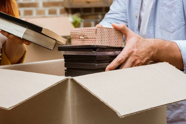 Couple unpacking box at home — Stock Photo