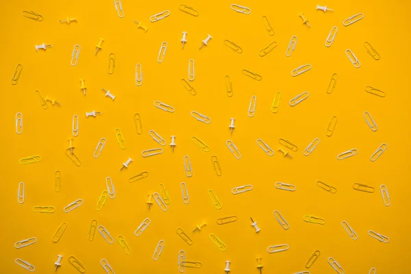 White paperclips and pins — Stock Photo