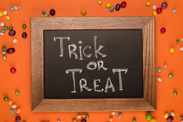 Chalkboard with trick or treat inscription — Stock Photo