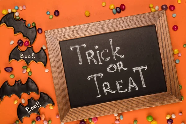 Chalkboard with trick or treat inscription — Stock Photo