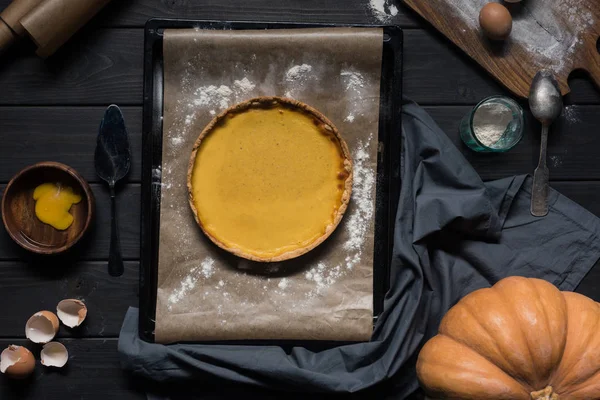 Pumpkin pie on baking tray — Stock Photo