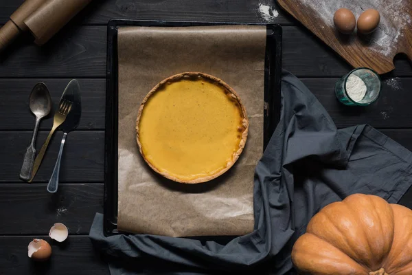 Pumpkin pie on baking tray — Stock Photo