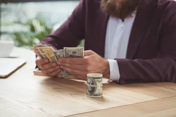 Businessman counting money — Stock Photo