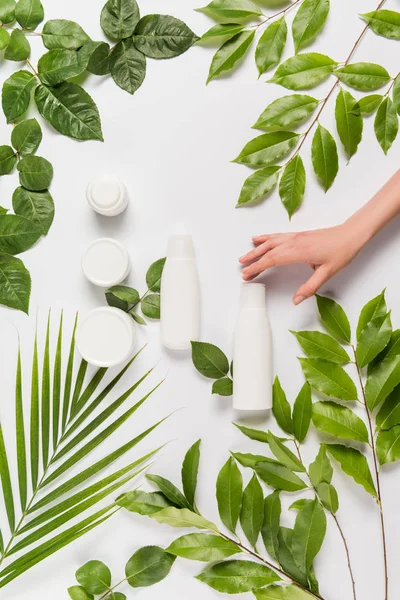 Hand with organic cream and lotion — Stock Photo