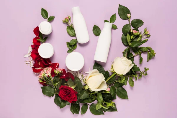 Body lotion and cream with roses — Stock Photo