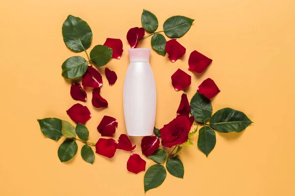 Lotion in floral frame — Stock Photo