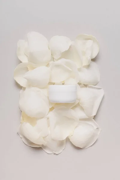 Cream on white petals — Stock Photo