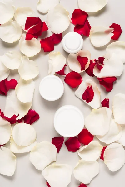 Organic cream on petals — Stock Photo