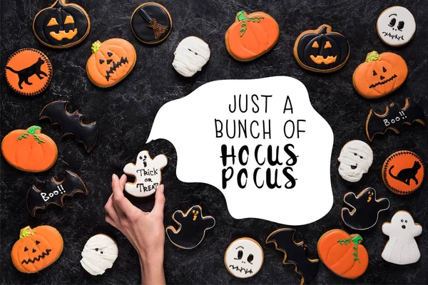 Woman holding halloween cookie — Stock Photo