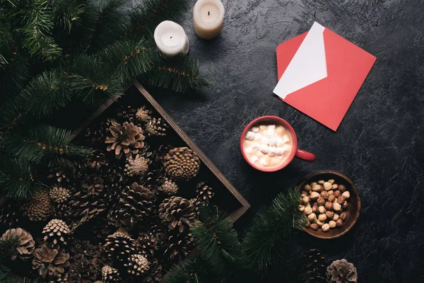 Christmas decorations, envelope and cup of cacao — Stock Photo