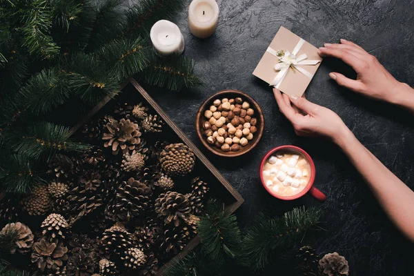 Pine cones, cup of cacao and envelope — Stock Photo