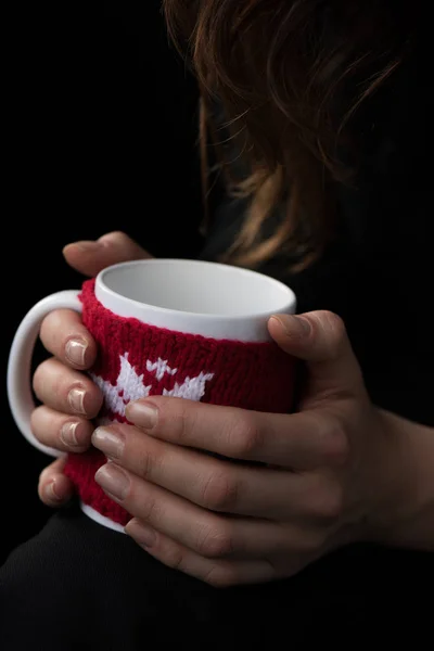 Cup in female hands — Stock Photo