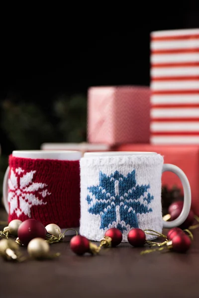 Cups and christmas balls — Stock Photo