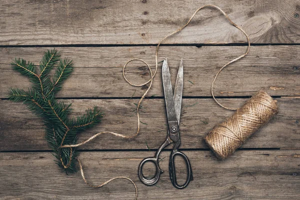 Fir, scissors and twine for Christmas decorations — Stock Photo
