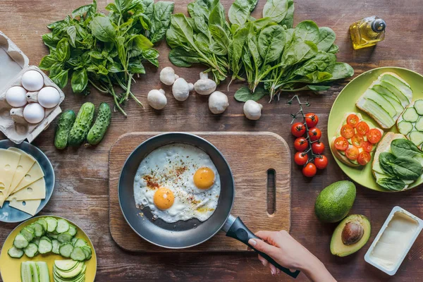 Eggs on frying pan — Stock Photo