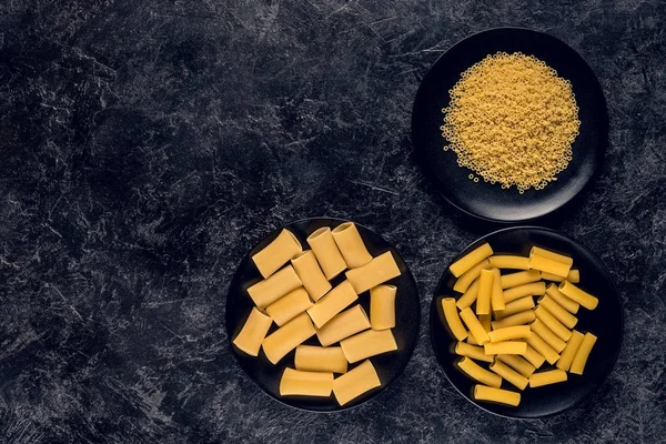 Various pasta in bowls — Stock Photo