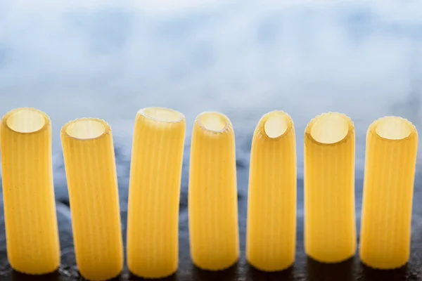Pasta standing in row — Stock Photo