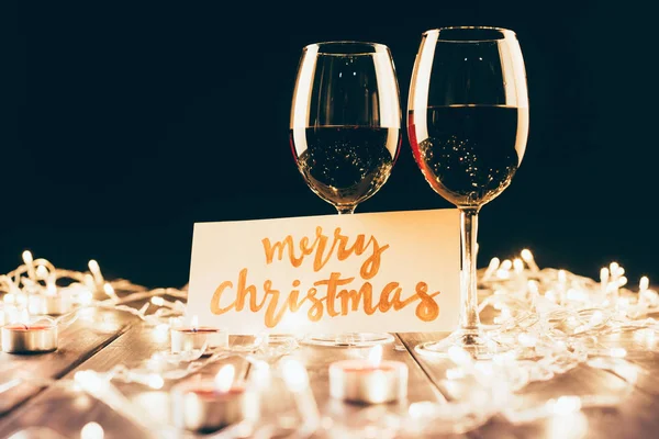 Wine and merry christmas card — Stock Photo