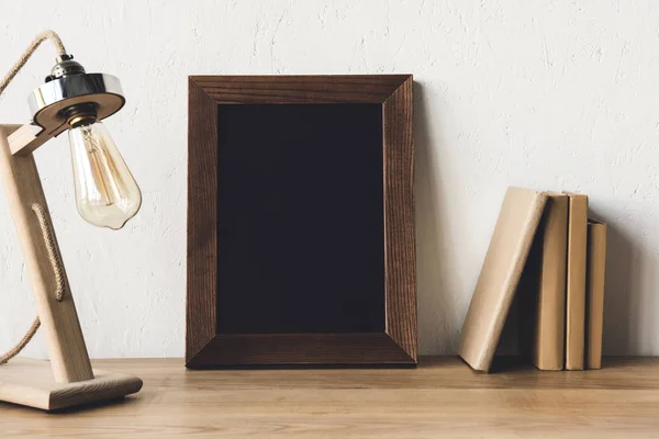 Empty photo frame at workplace — Stock Photo