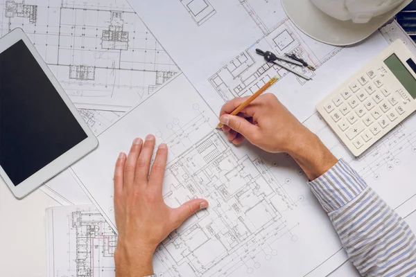 Architect working with blueprints — Stock Photo