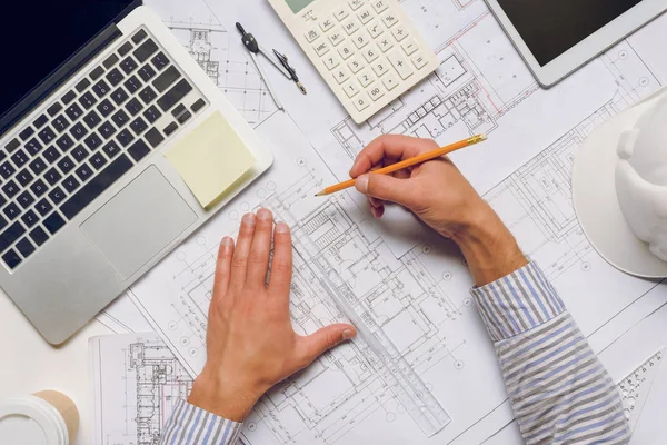 Architect working with blueprints — Stock Photo