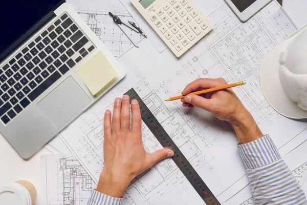 Architect working with blueprints — Stock Photo