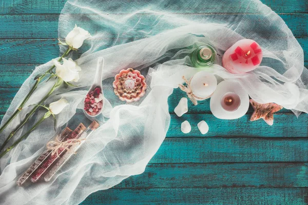 Soap and bathroom salt in flasks and spoon — Stock Photo