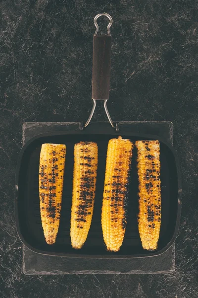 Grilled corn on frying pan — Stock Photo