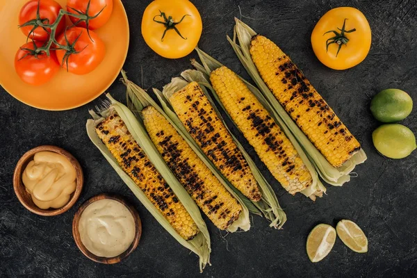 Grilled corn covered in leaves — Stock Photo