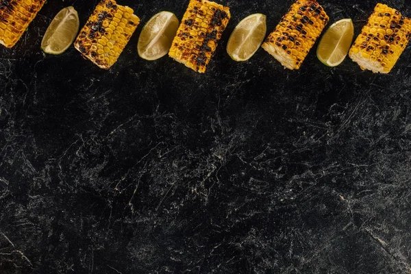 Grilled corn and lime slices — Stock Photo