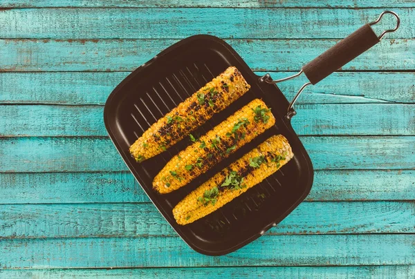 Grilled corn on frying pan — Stock Photo