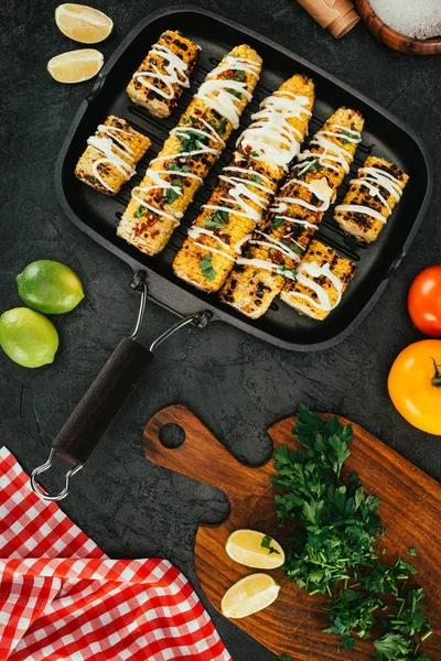 Grilled corn on frying pan — Stock Photo