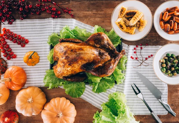 Baked turkey in middle of served table — Stock Photo