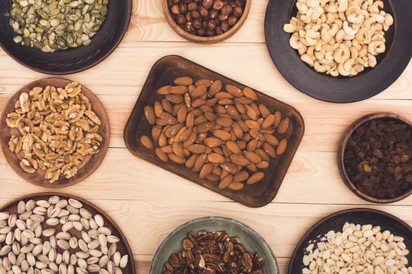 Various nuts in bowls — Stock Photo