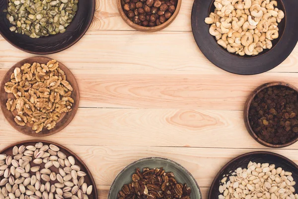 Various nuts in bowls — Stock Photo