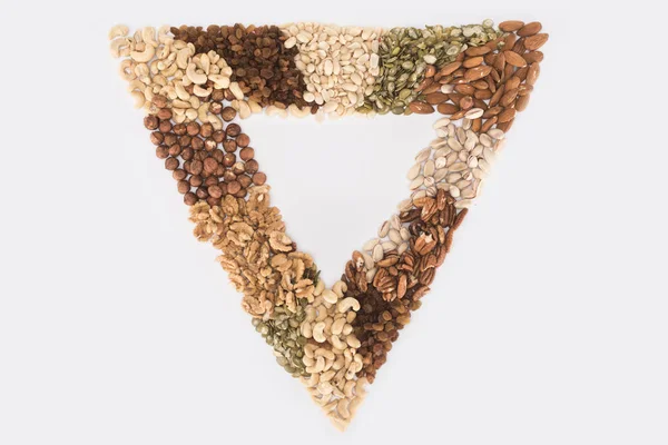 Triangle symbol from nuts — Stock Photo