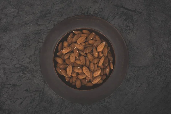 Delicious almonds on plate — Stock Photo