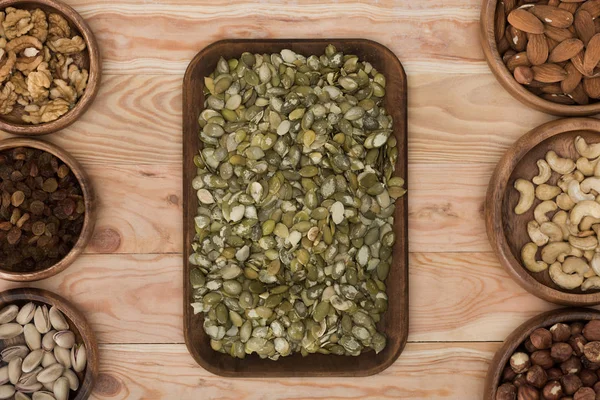 Pumpkin seeds and nuts — Stock Photo