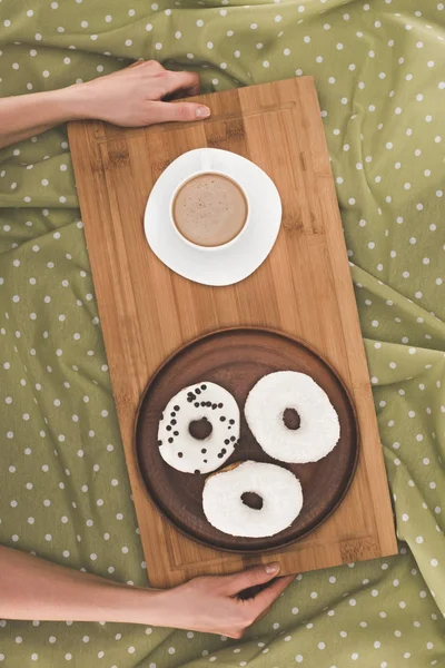 Doughnuts and coffee on tray — Stock Photo