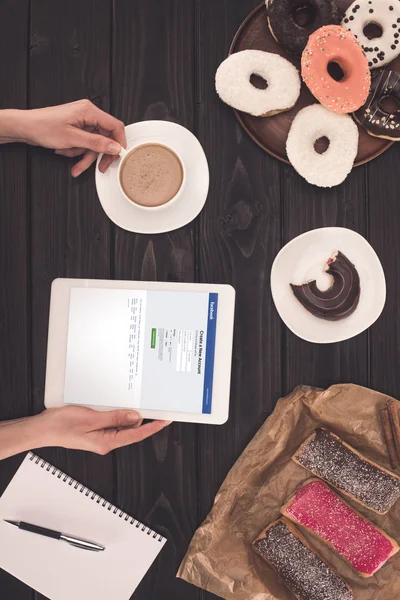 Person with digital tablet and coffee — Stock Photo