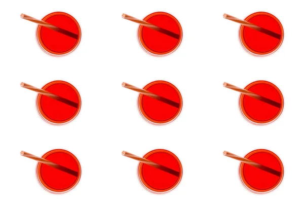 Glasses of juice with straws — Stock Photo