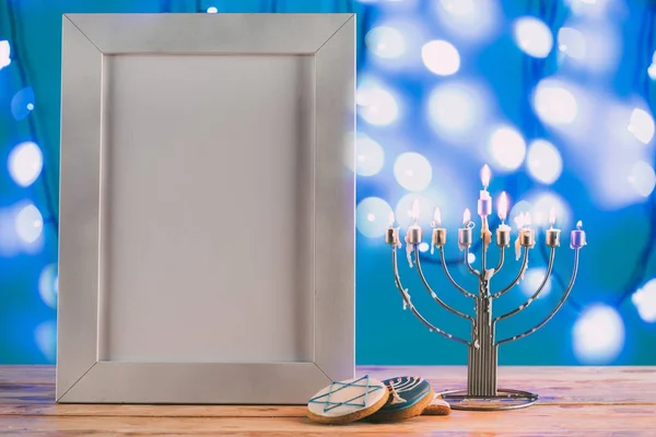 Menorah and frame with copy space for hanukkah — Stock Photo