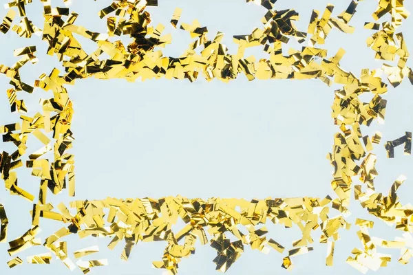 Рамка из золотых конфетти — стоковое фото