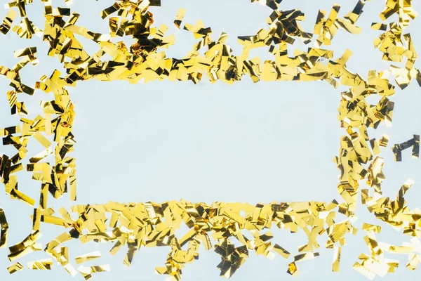 Quadro feito de confete dourado — Fotografia de Stock