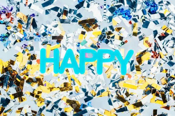 Happy sign with colorful confetti — Stock Photo