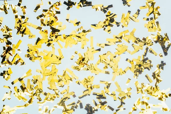 Golden glossy confetti — Stock Photo