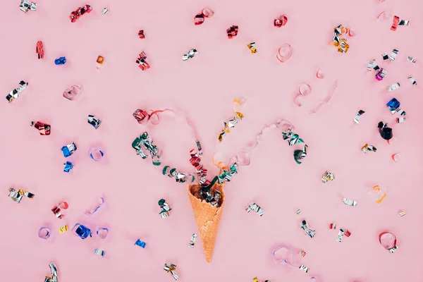 Confetti spilling out waffle cone — Stock Photo