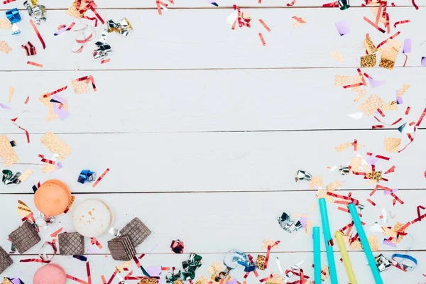 Frame made of confetti and sweets — Stock Photo